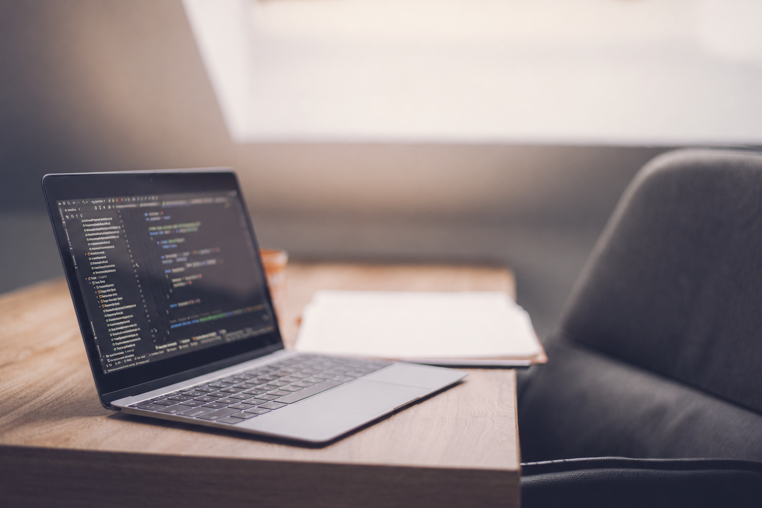 Software development code displayed on a laptop
